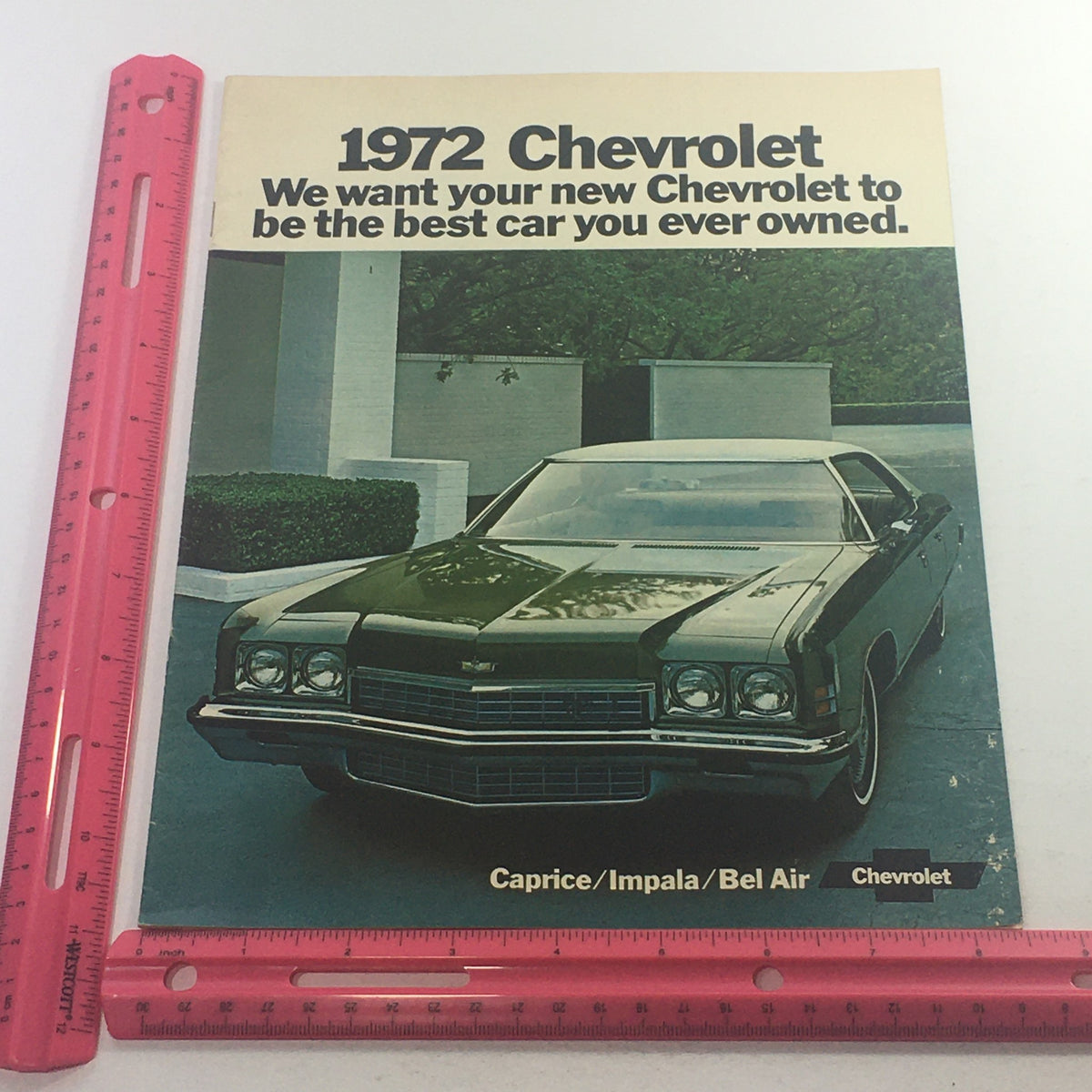 1972 Chevrolet Caprice/Impala/Bel Air List Dealership Car Auto Brochure Catalog with a focus on a beautifully arranged Chevrolet Caprice displayed in front of a modern architecture, promising a top-quality Chevrolet ownership experience.