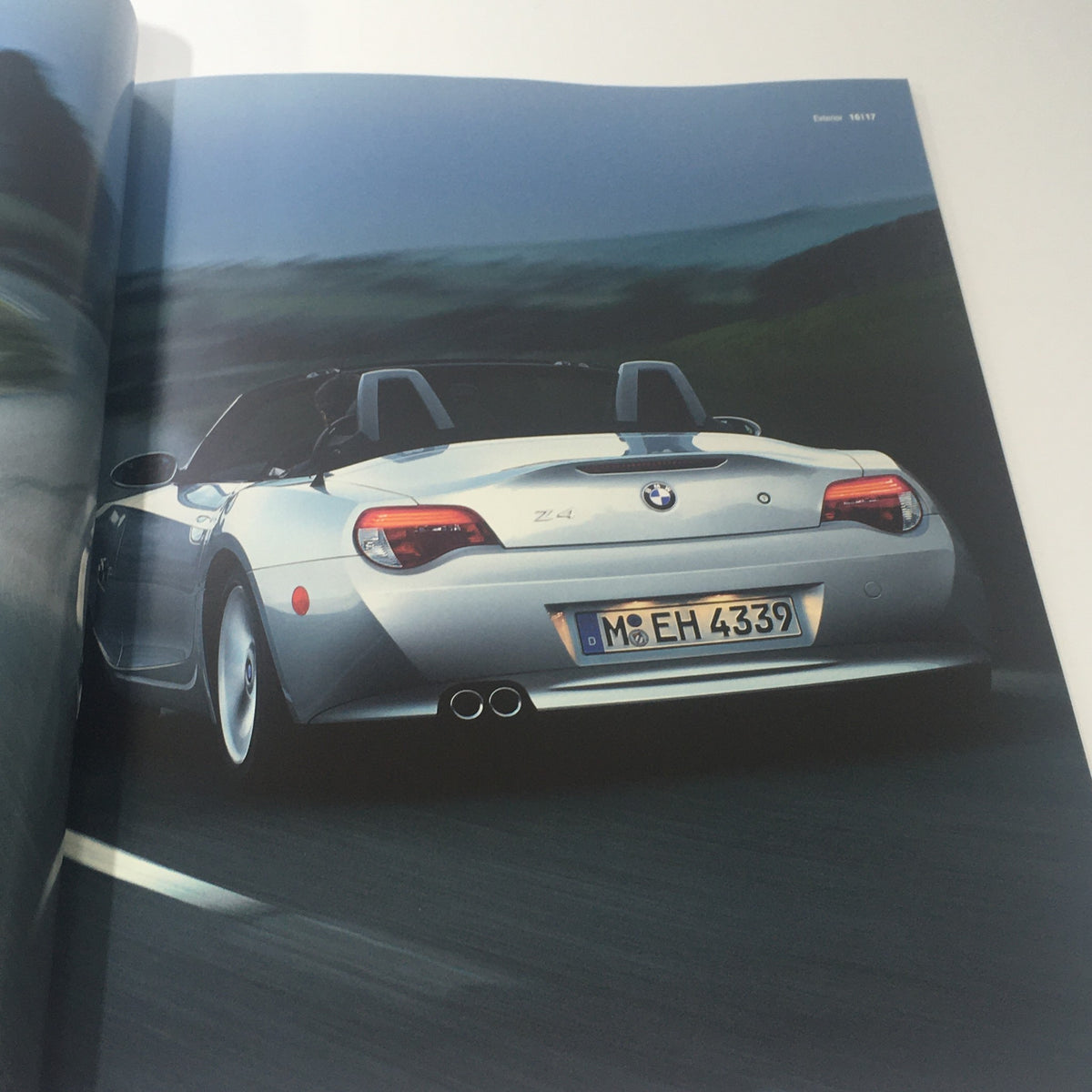 Inside page of the 2007 BMW Z4 Roadster Coupe 3.0i 3.0si Dealership Car Auto Brochure Catalog showcasing a rear view of the silver BMW Z4 with license plate.