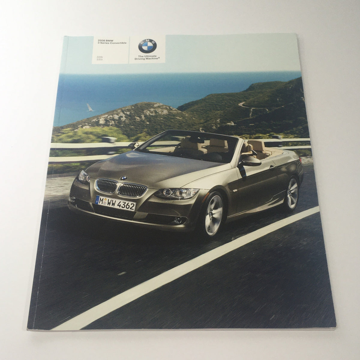 Cover of the 2008 BMW 3 Series 328i 335i Convertible Dealership Car Auto Brochure Catalog featuring a sleek convertible on a winding road.