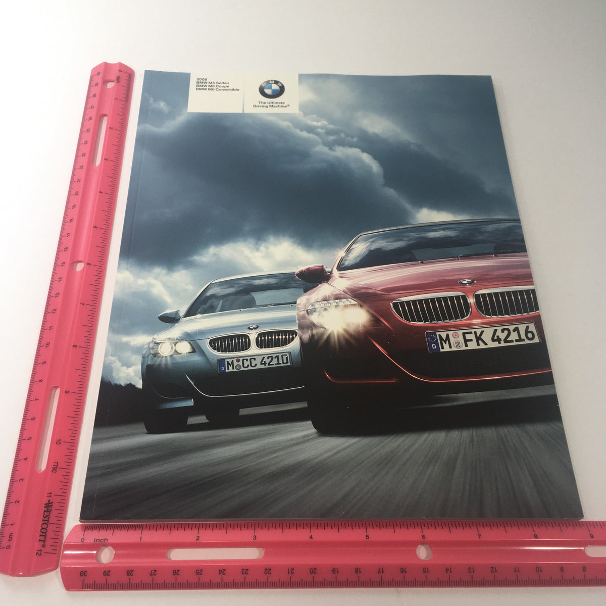 2008 BMW M5 Sedan M6 Coupe M6 Convertible Dealership Car Auto Brochure Catalog cover image with a ruler for size reference, displaying the front view of two BMW cars.
