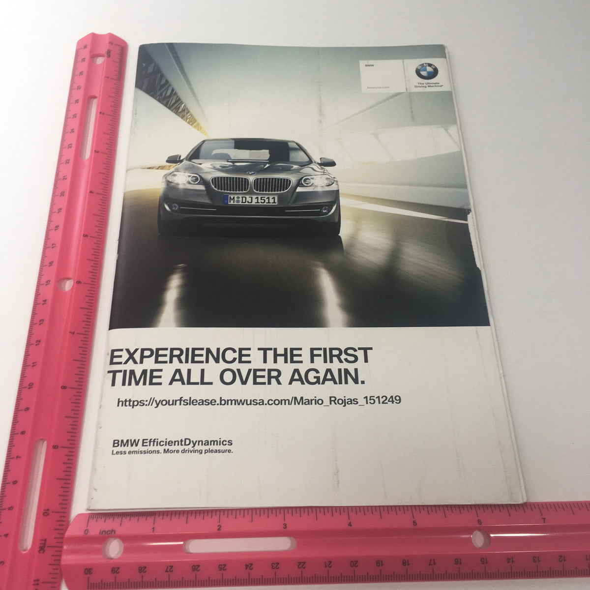 Front cover of the 1994-2010 BMW Full Line 3 Series Model Dealership Car Auto Brochure Catalog featuring a BMW car and the statement 'EXPERIENCE THE FIRST TIME ALL OVER AGAIN' with a ruler for size reference.