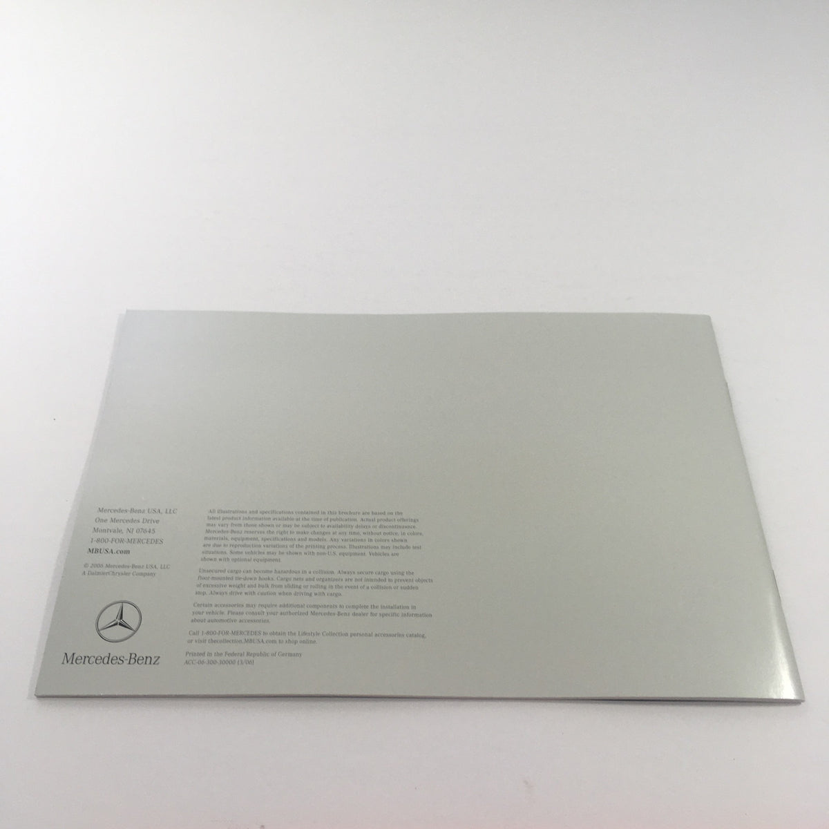 Back cover of the 2006 Mercedes-Benz SL-Class Accessories catalog featuring the Mercedes-Benz logo and company information.