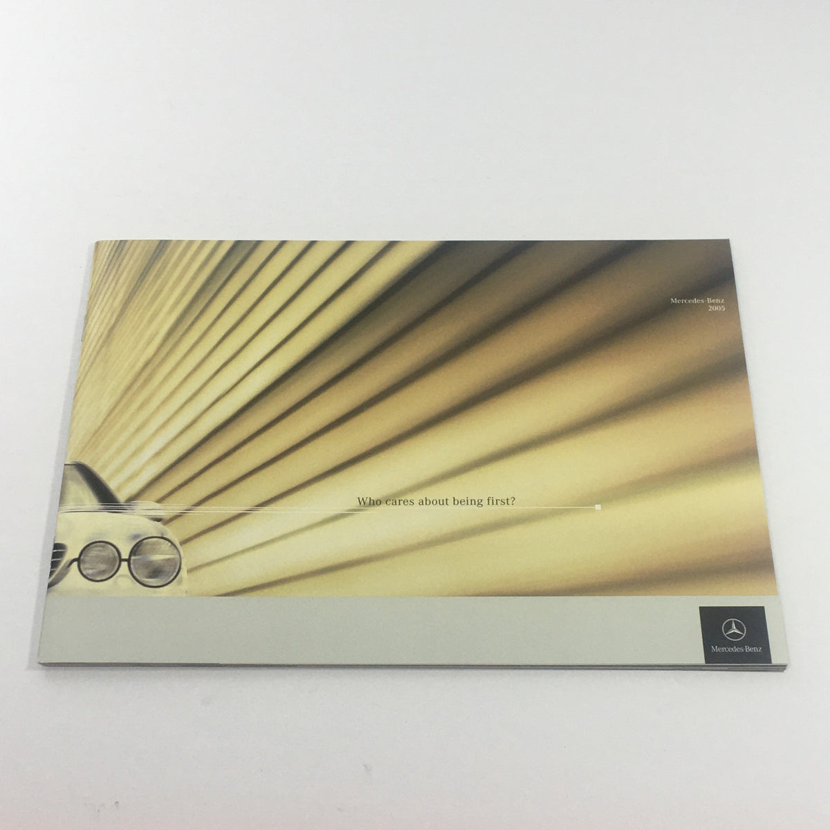 Cover of the 2005 Mercedes-Benz C230 Dealership Car Auto Brochure Catalog featuring a modern design with sleek lines and a silver color scheme.