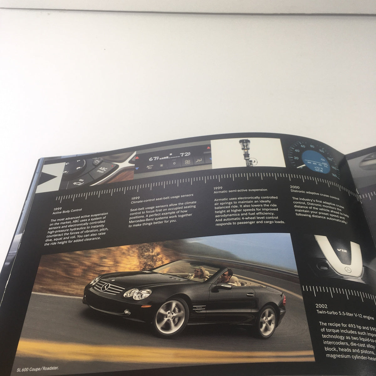 Detailed view of the 2006 Mercedes-Benz Soul S-500 Sedan brochure showcasing car instrumentation and performance specifications.