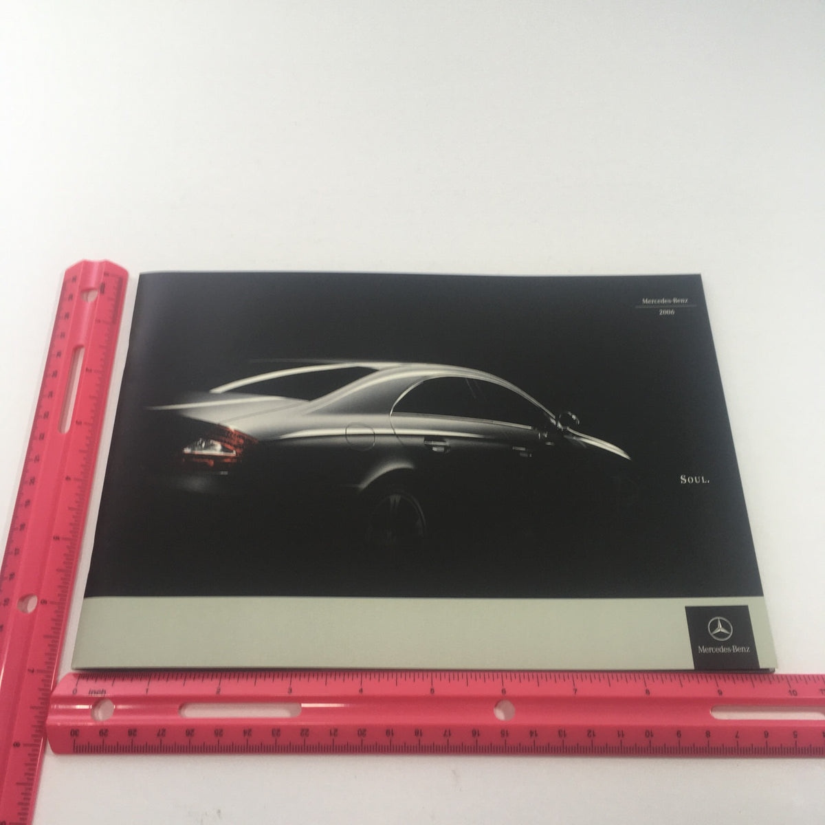 2006 Mercedes-Benz Soul S-500 Sedan Dealership Car Auto Brochure showing the sleek rear silhouette of the vehicle against a dark background, highlighting its elegant design.
