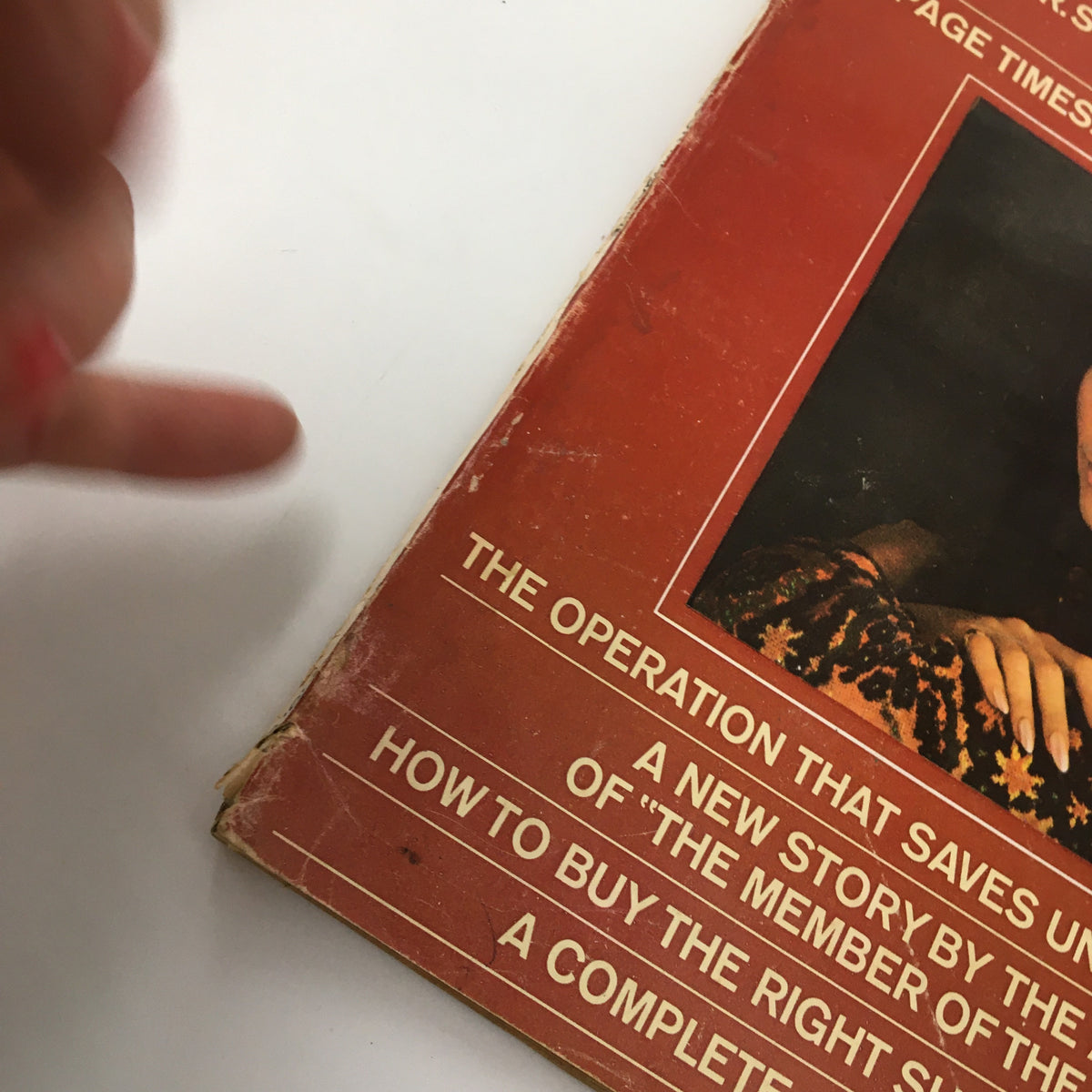 Close-up view of the VTG Redbook Magazine March 1967 cover, highlighting the title 'The Operation That Saves Unborn Babies' Lives' with visible signs of wear, illustrating its vintage condition.
