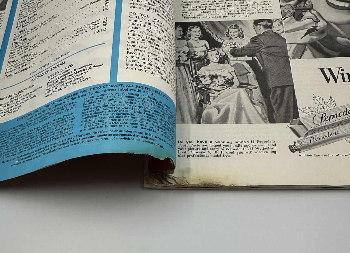 Interior page of Woman’s Home Companion Magazine August 1948 featuring an advertisement for Pepsodent toothpaste and highlighting its benefits with a vibrant blue section. Examination of magazine condition reveals significant wear, particularly along the edges.