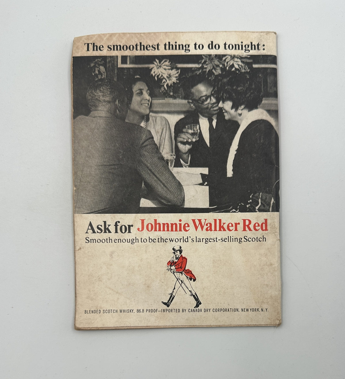 Vintage advertisement for Johnnie Walker Red whisky featured in Jet Magazine, September 16, 1965 edition, showcasing a lively social gathering and emphasizing the slogan 'The smoothest thing to do tonight.'