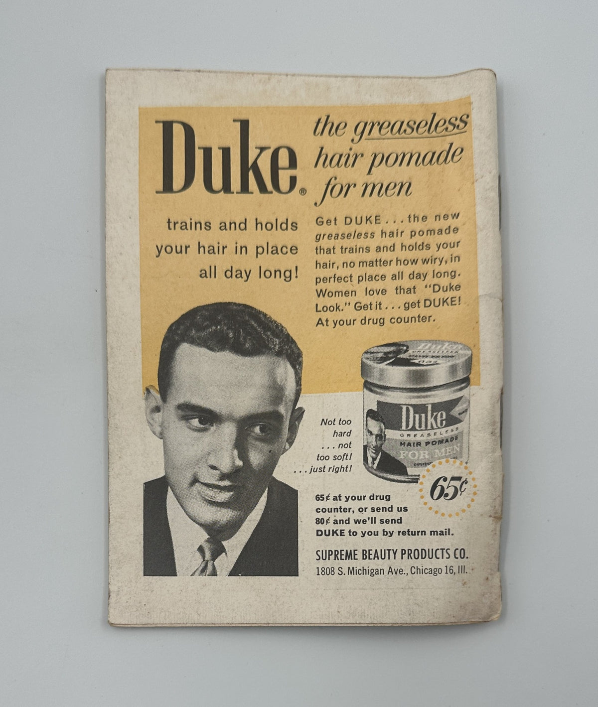 Jet Magazine April 13, 1961 featuring a vintage advertisement for Duke, the greaseless hair pomade for men, showcasing a smiling man holding the product and promoting its benefits. This cover highlights the era's style and cultural themes relevant to its publication date.