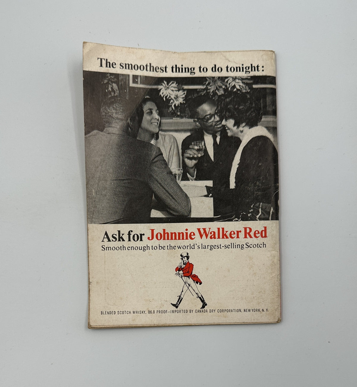 Advertisement from Jet Magazine January 20, 1966 promoting Johnnie Walker Red Scotch, showcasing a social gathering.