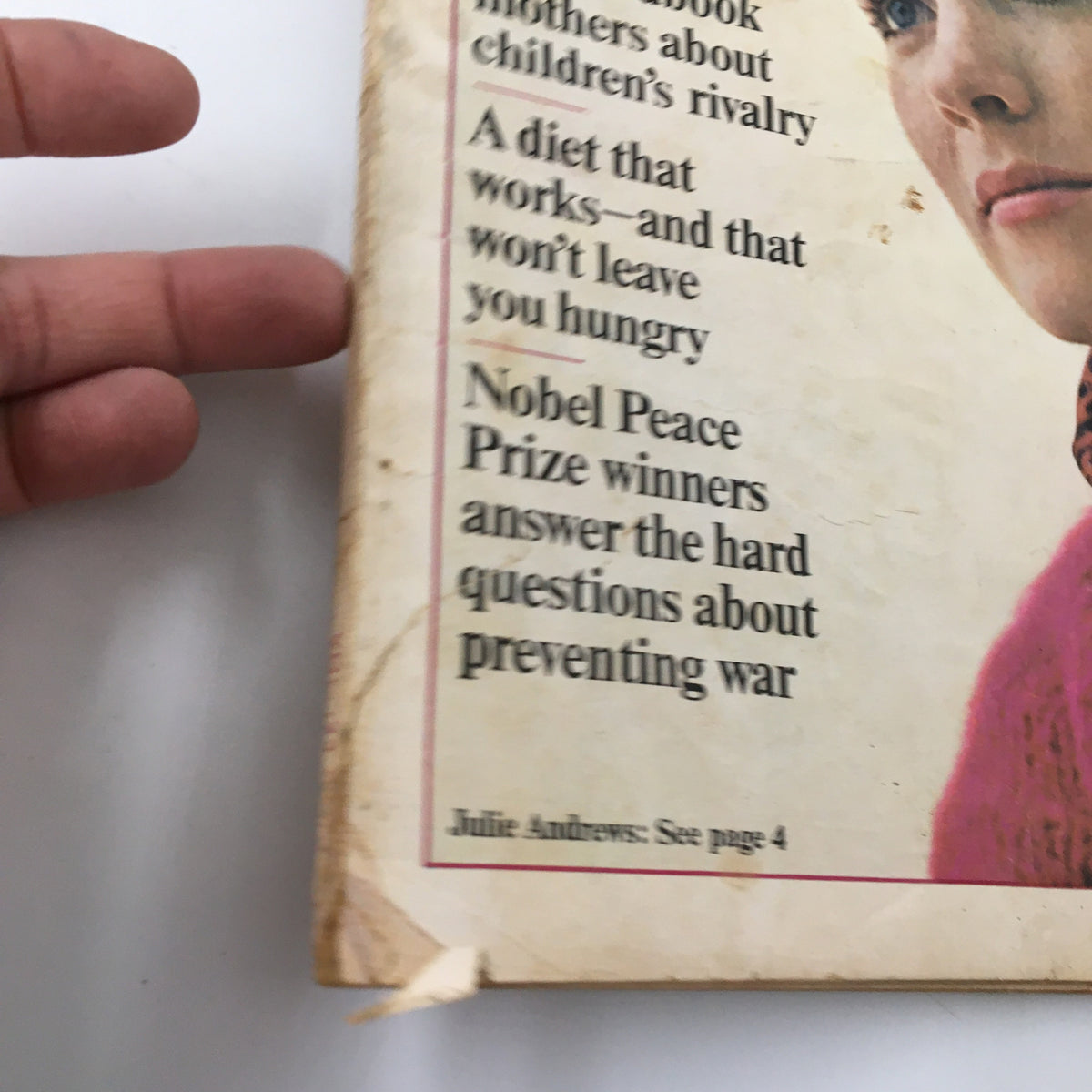 Side view of the VTG Redbook Magazine January 1965 cover displaying article highlights including discussions featuring Dr. Spock and Nobel Peace Prize winners.