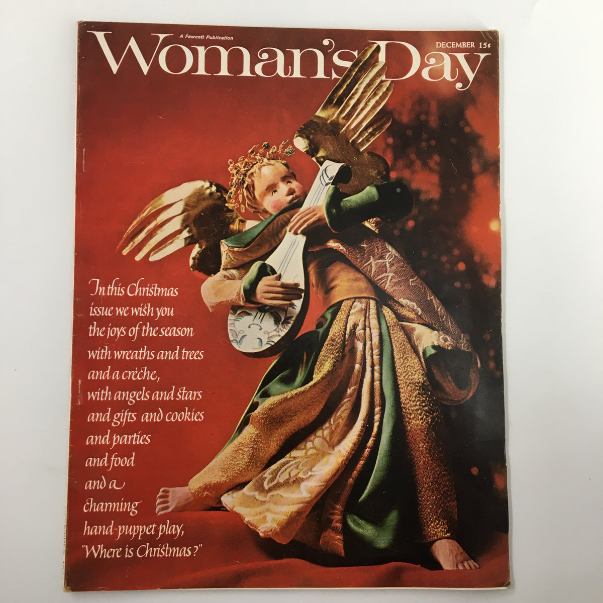 Cover of the VTG Woman's Day Magazine December 1963 featuring a festive hand-puppet play illustration with an angel and guitar, embodying the holiday spirit.