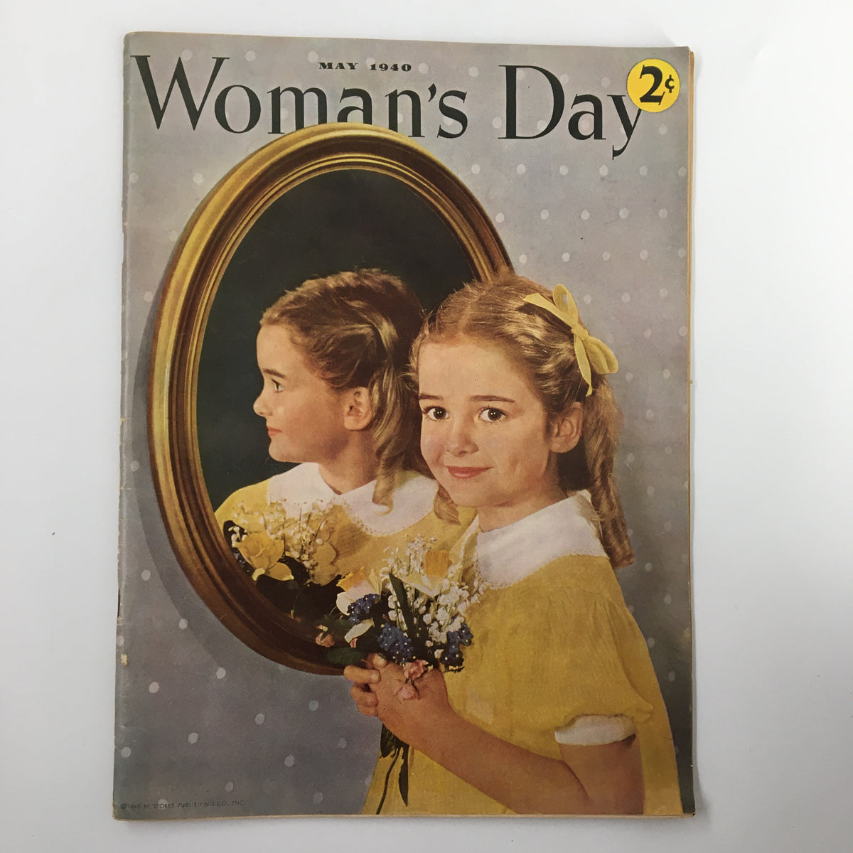 Cover of VTG Woman's Day Magazine May 1940 featuring a girl with flowers and a mirror, showcasing vintage aesthetic and historical design.