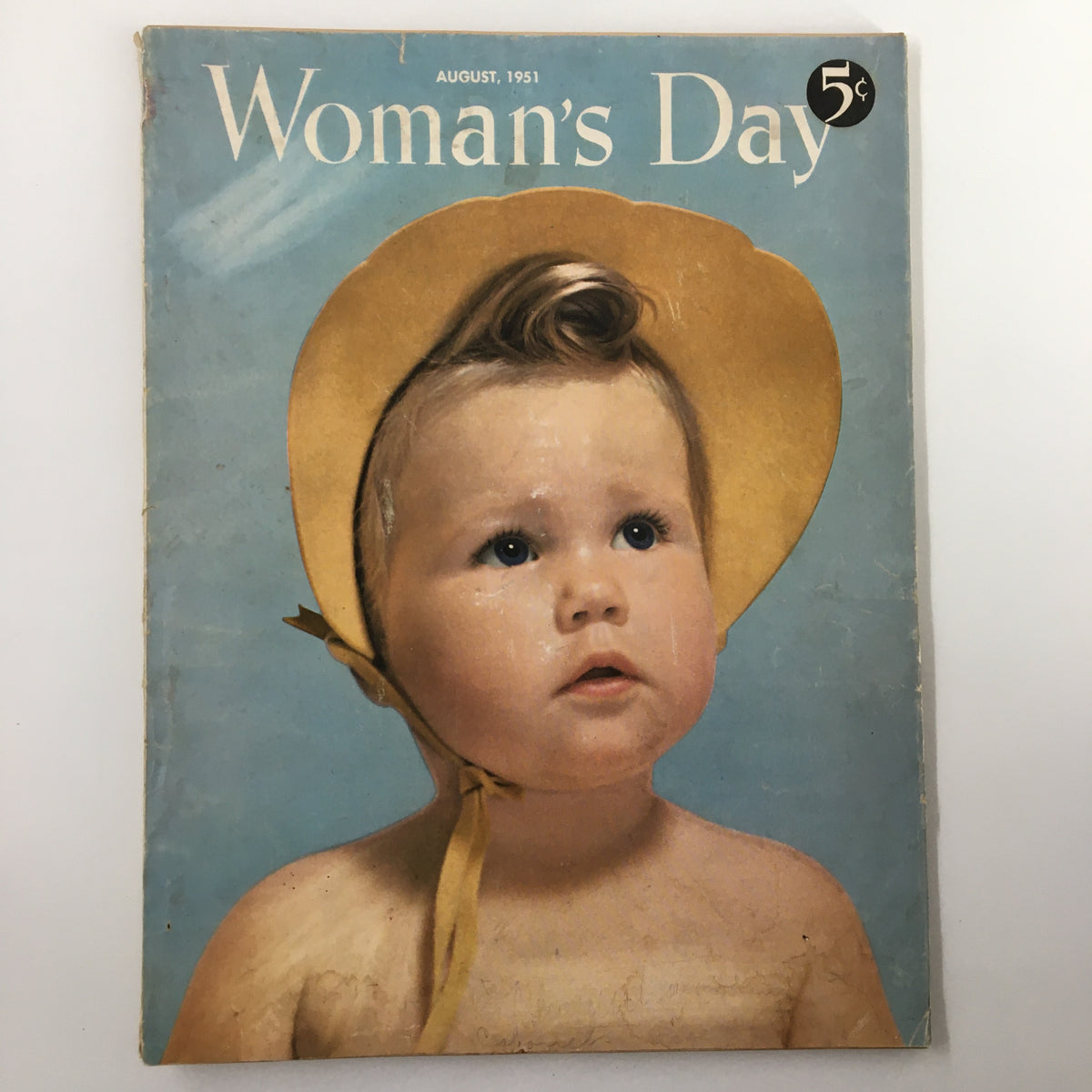Cover of VTG Woman's Day Magazine August 1951 titled 'A Day at the Beach', featuring an adorable child with a yellow sun hat.