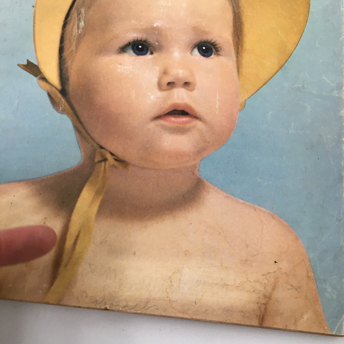 Close-up of the cover of VTG Woman's Day Magazine August 1951, showcasing a child in a yellow sun hat and details of the nostalgic cover design.