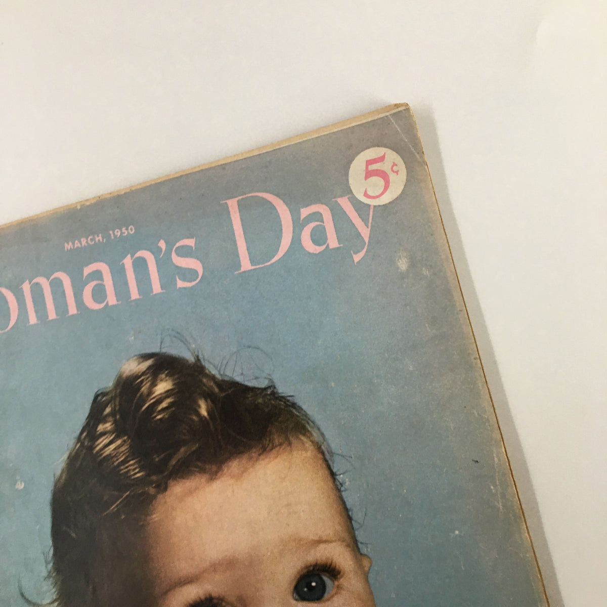 Detail shot of the upper corner of the Vintage Woman's Day Magazine March 1950 cover, featuring the price tag of 5 cents.