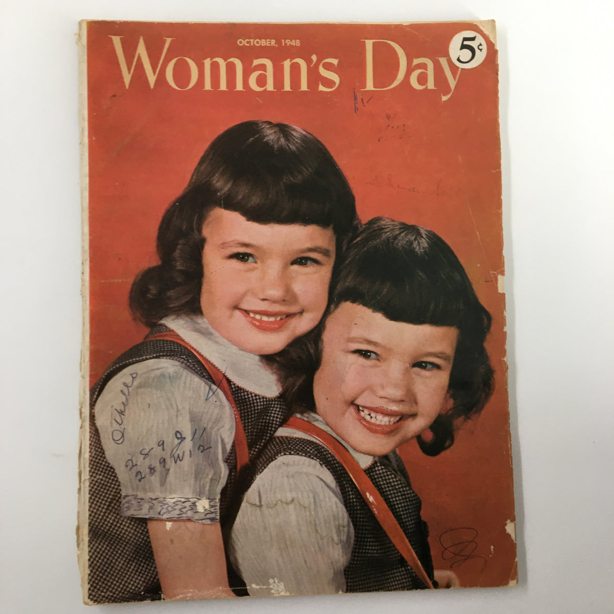 Cover of VTG Woman's Day Magazine October 1948 featuring two smiling girls, showcasing vintage style and nostalgic designs.