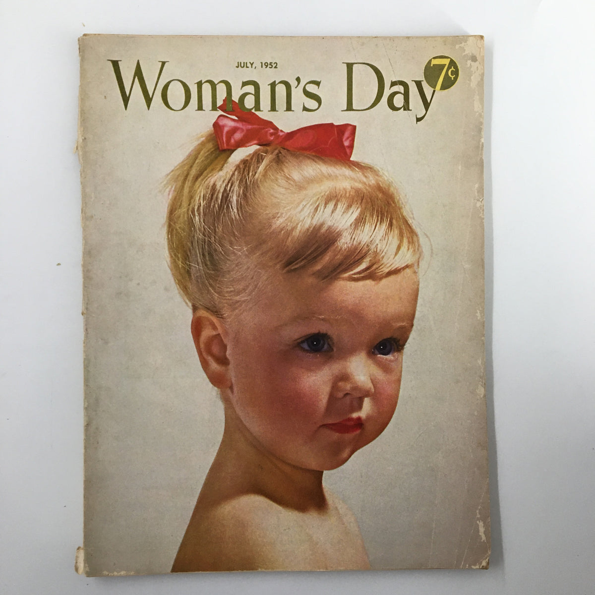 Cover of the VTG Woman's Day Magazine from July 1952, featuring a charming young girl with a red bow in her hair.