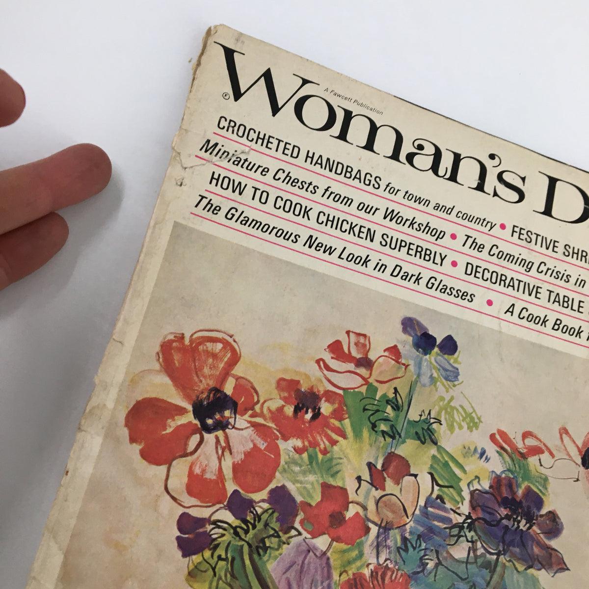 Close-up of the cover of VTG Woman's Day Magazine May 1966 showing floral design and text including 'The Glamorous New Look in Dark Glasses.'