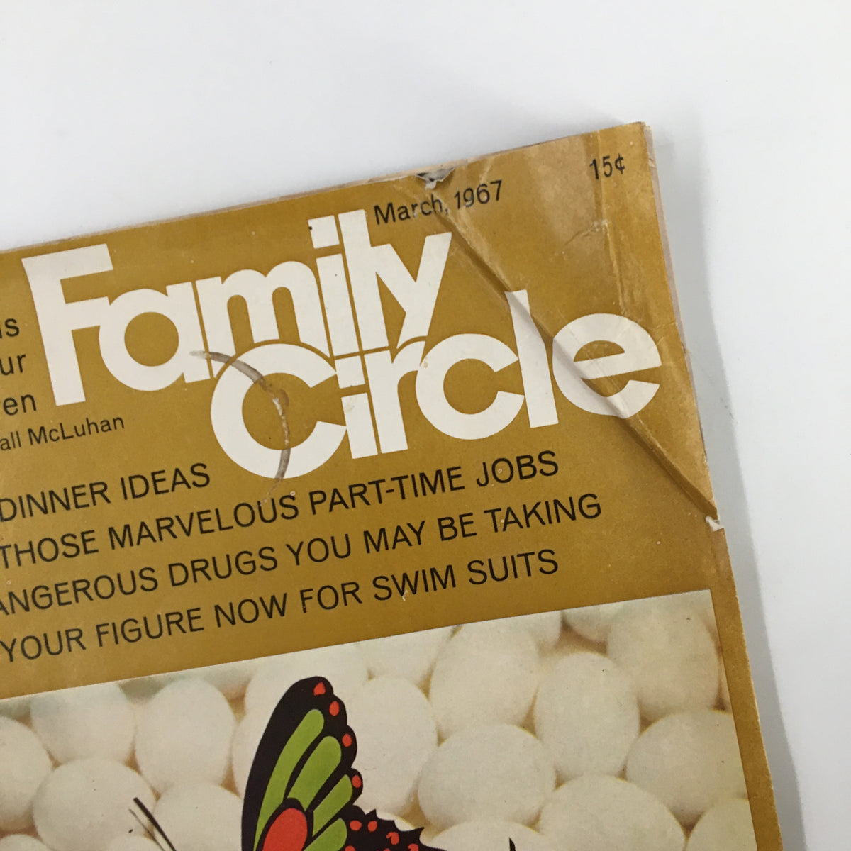 Close-up of the cover of VTG Woman's Day Magazine March 1967, showing the title and butterfly illustrations, emphasizing retro design.