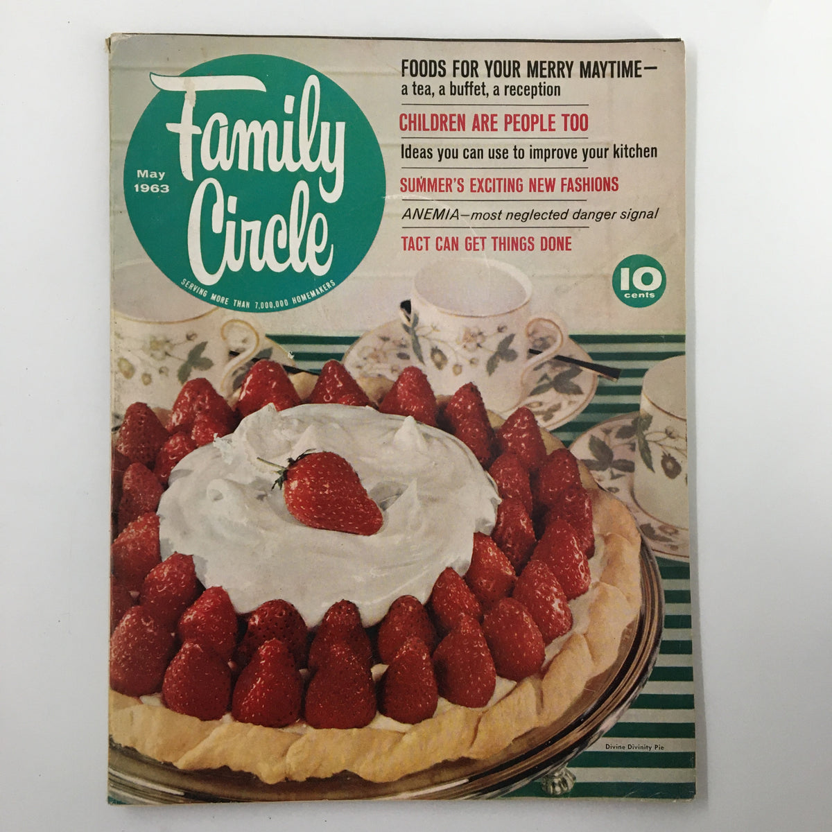Cover of VTG Family Circle Magazine May 1963 titled 'Foods For Your Merry Maytime', featuring a dessert pie topped with strawberries, accompanied by tea cups on a green-striped table.