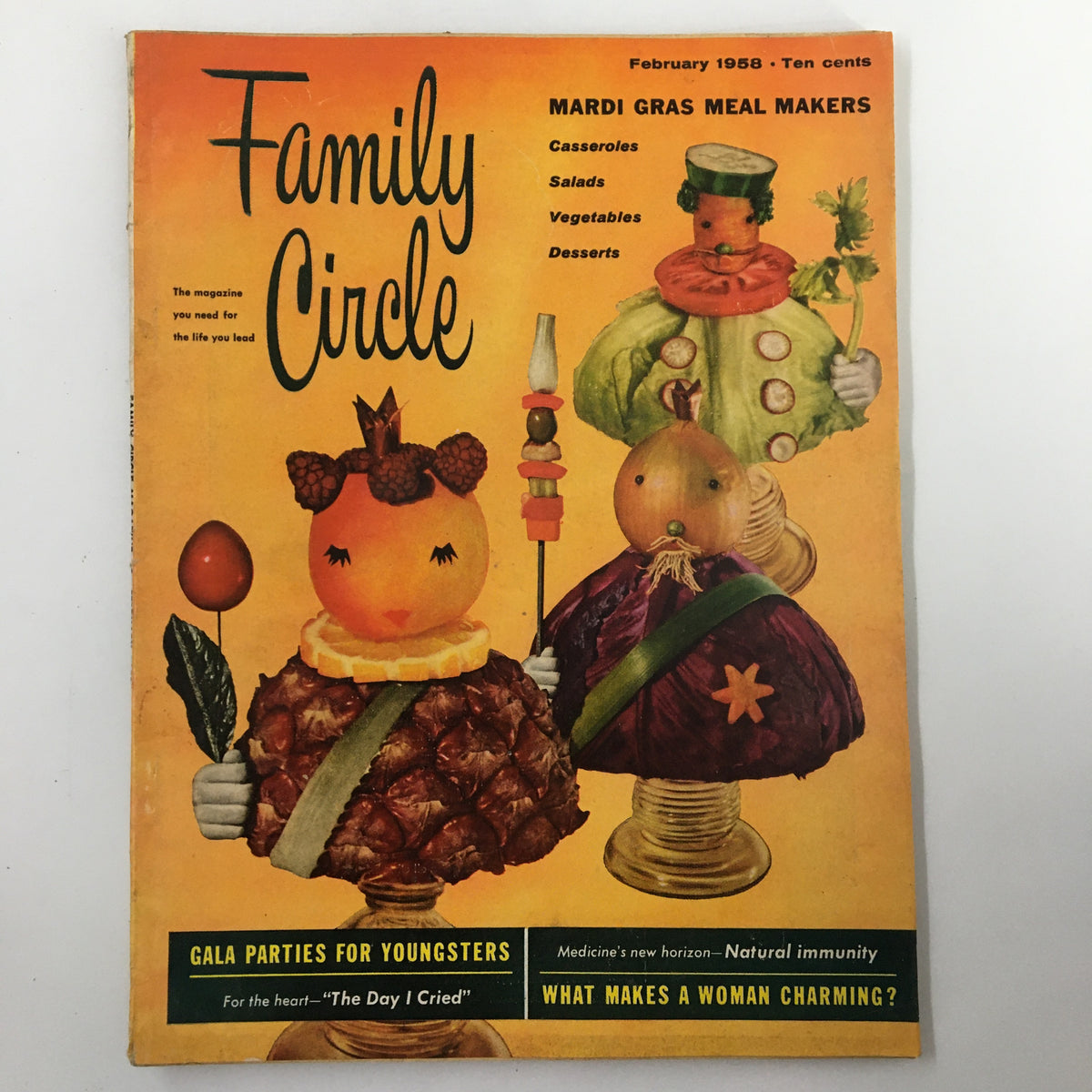 Family Circle Magazine cover from February 1958 featuring Mardi Gras Meal Makers theme, showcasing vibrant food imagery including casseroles, salads, vegetables, and desserts.