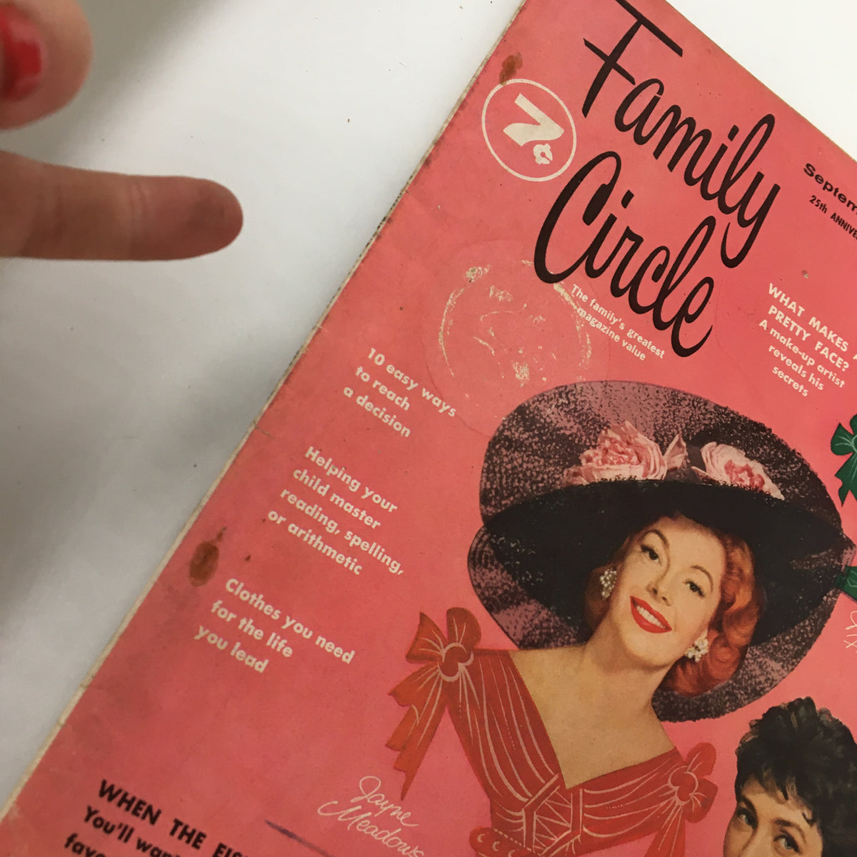 Close-up of the Vintage Family Circle Magazine September 1957 cover highlighting the features and articles, including insights on family decisions and child education.