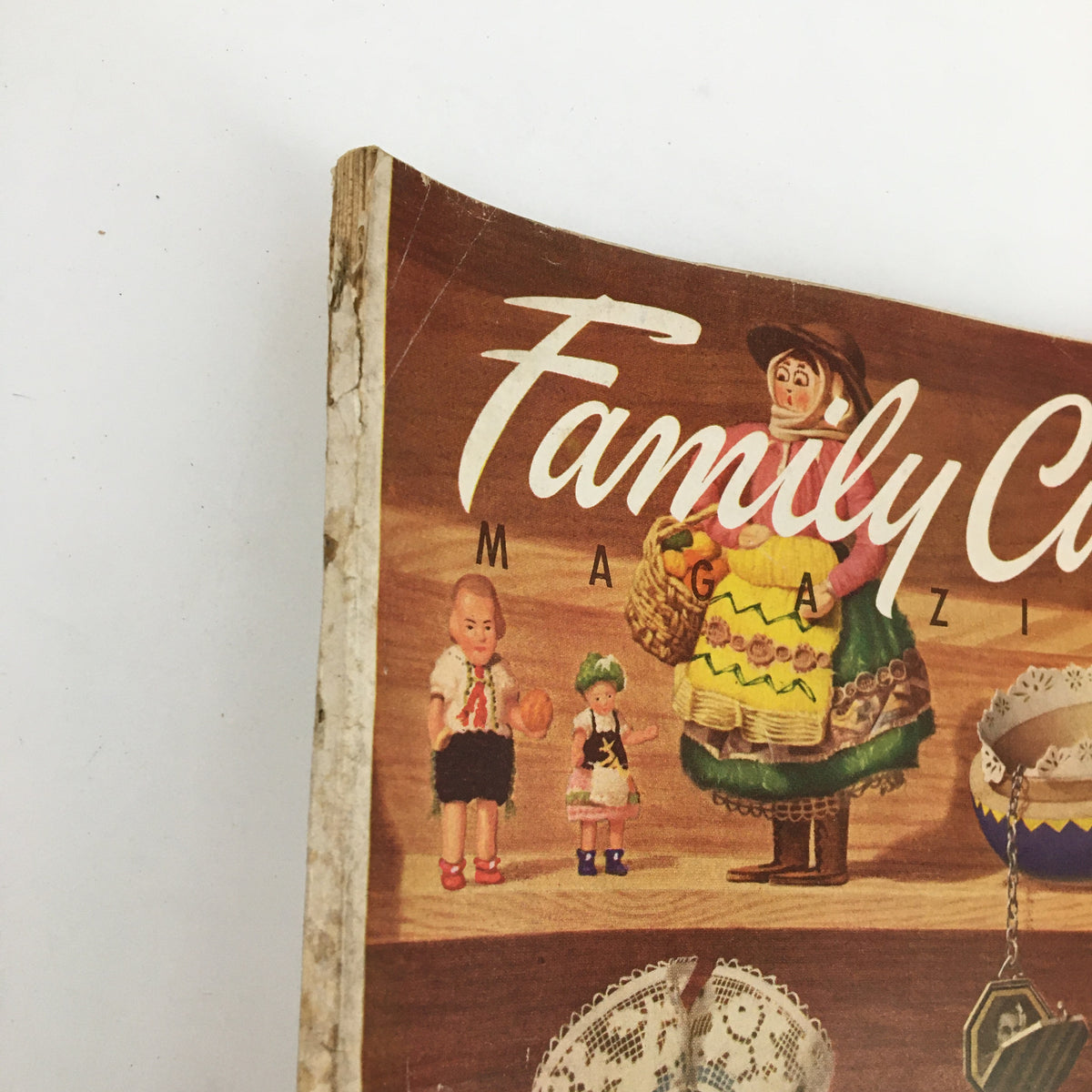 Side view of Vintage Family Circle Magazine April 1954 showing its wear and vintage charm.