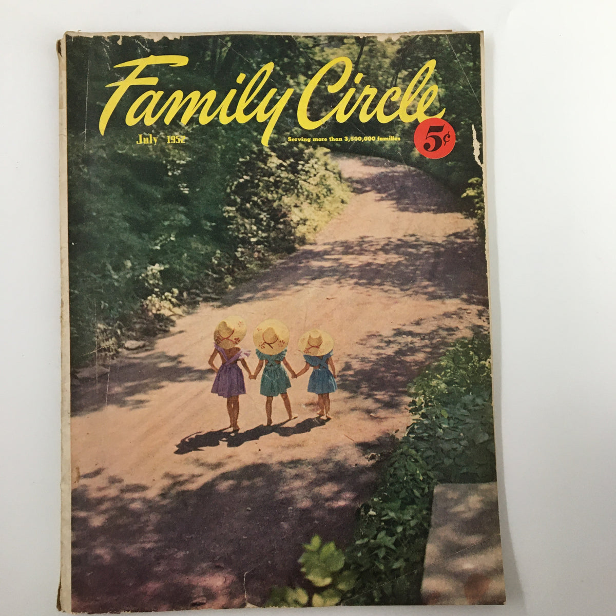 Vintage Family Circle Magazine cover from July 1952 featuring children walking hand in hand on a shady path, emphasizing a nostalgic theme with the title 'Family Circle' prominently displayed along with the price of 5 cents.