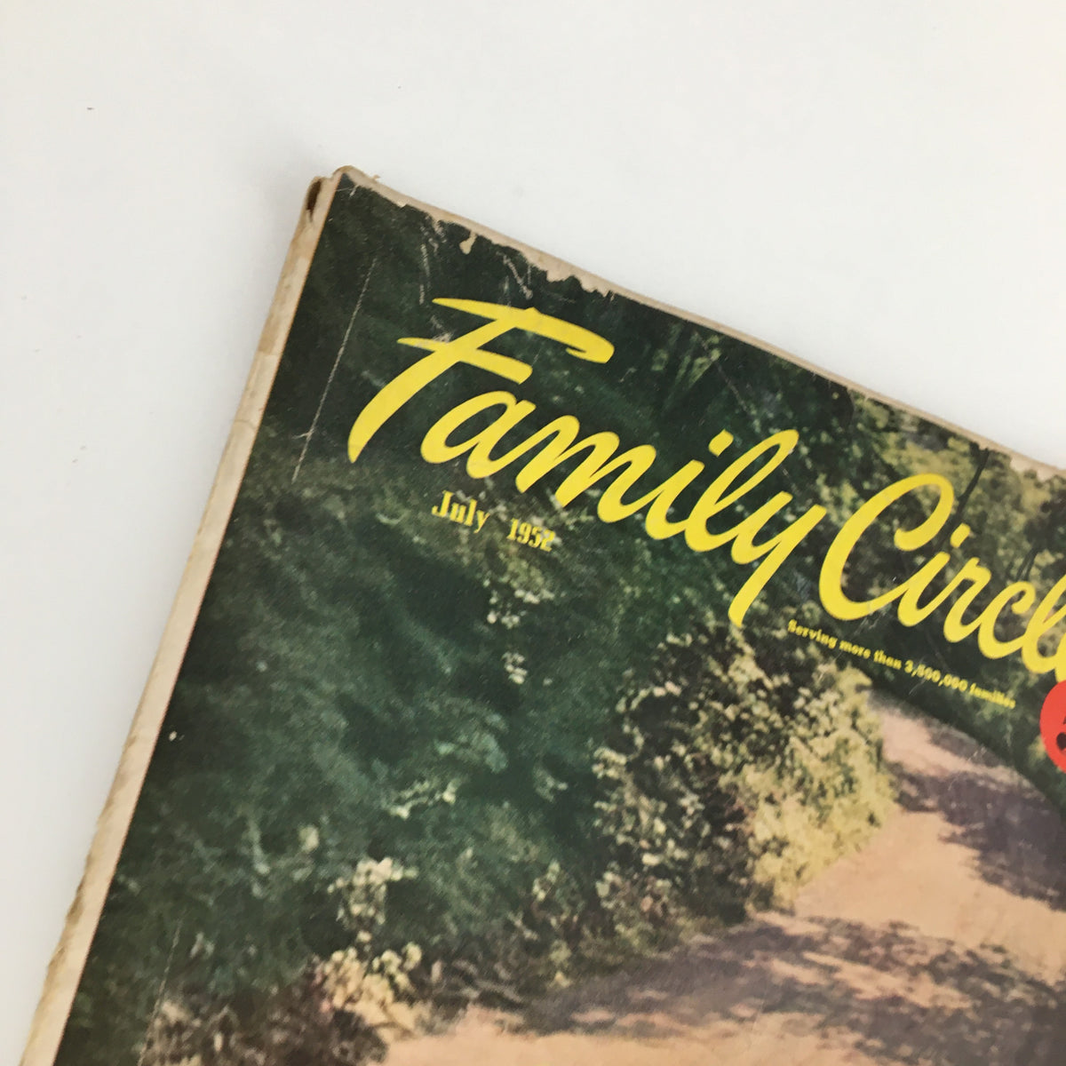Close-up view of the top corner of the July 1952 Family Circle Magazine cover, showcasing the title in a bold font and the scenic imagery indicative of family life in the 1950s.