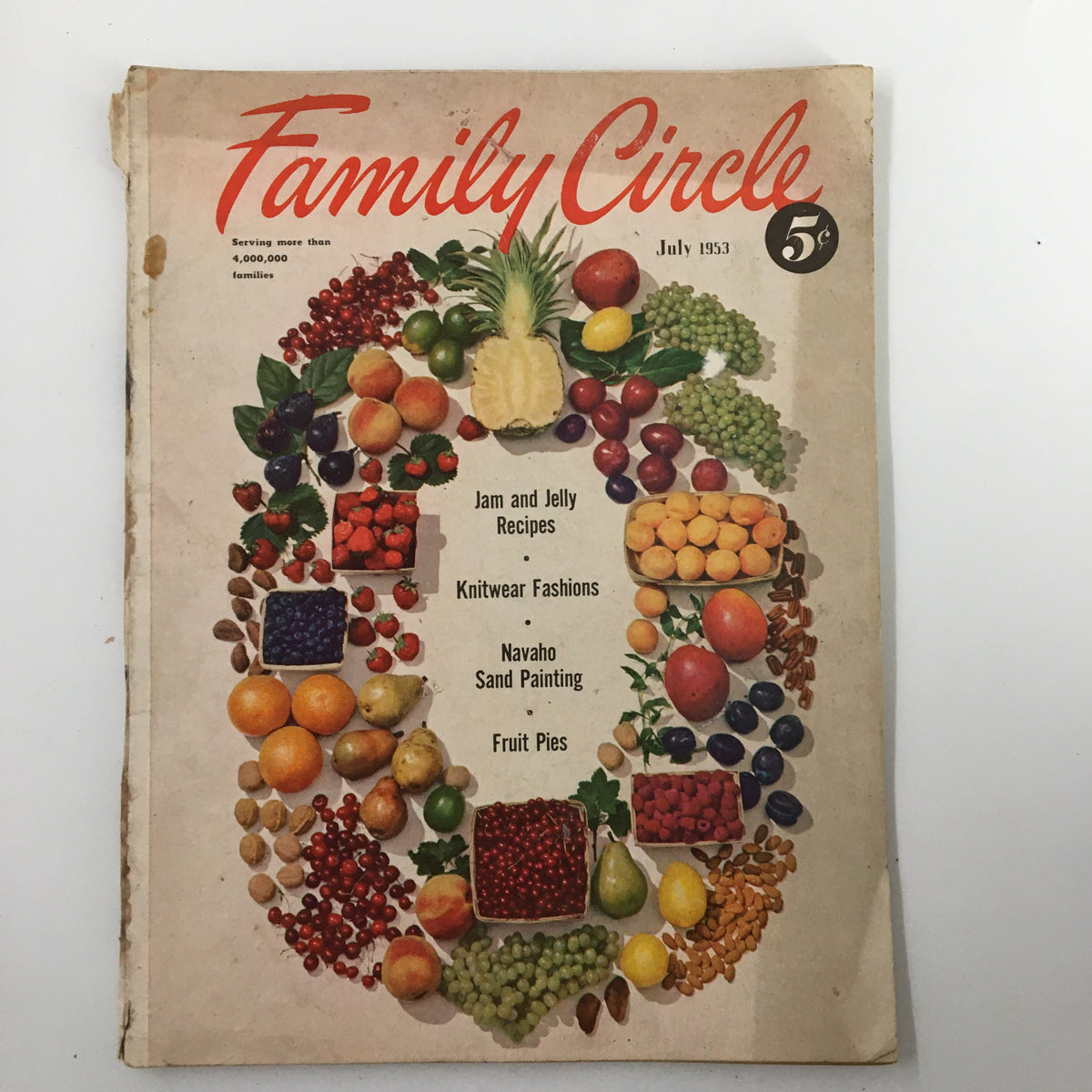 Cover of VTG Family Circle Magazine July 1953 featuring a vibrant display of fruit, Jam and Jelly recipes, Knitwear fashions, Navaho sand painting, and fruit pies.