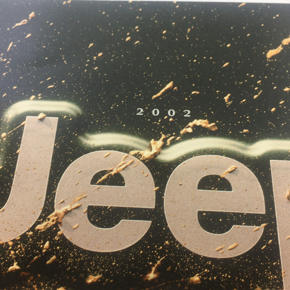 2002 Jeep Wrangler Sport Edition Dealership Car Auto Brochure Catalog cover showing the model name 'Jeep' with a textured background.