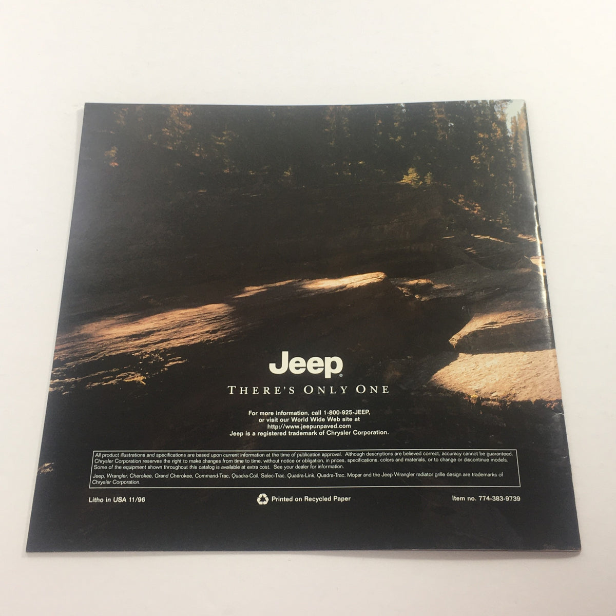 Back cover of the 1997 Jeep 4-Wheel Drive Dealership Car Auto Brochure Catalog, showcasing a serene landscape with water and trees, and the Jeep logo.