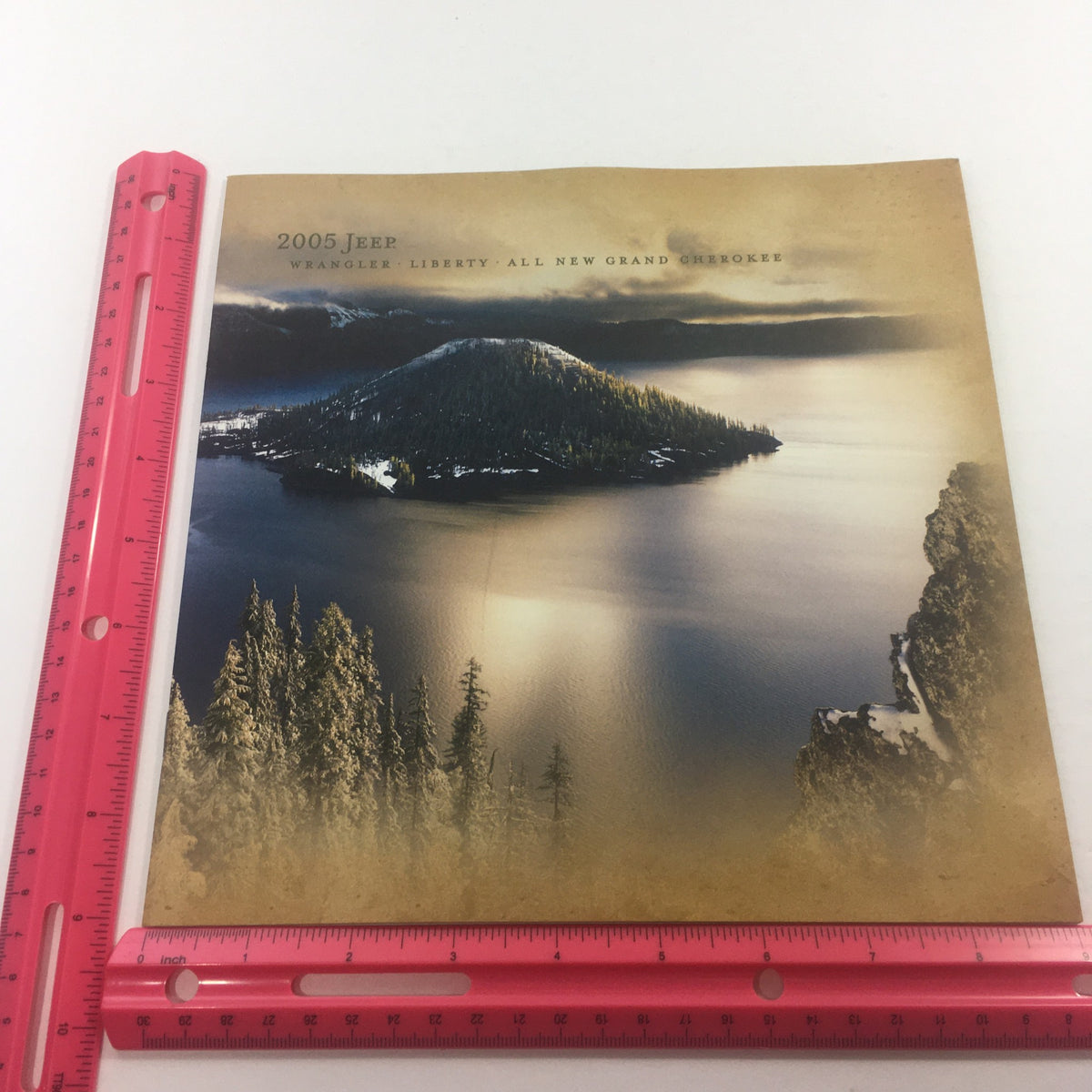 2005 Jeep Wrangler Liberty, Grand, Cherokee Dealership Car Auto Brochure Catalog displaying a tranquil lake and mountain view, with a ruler for size reference.