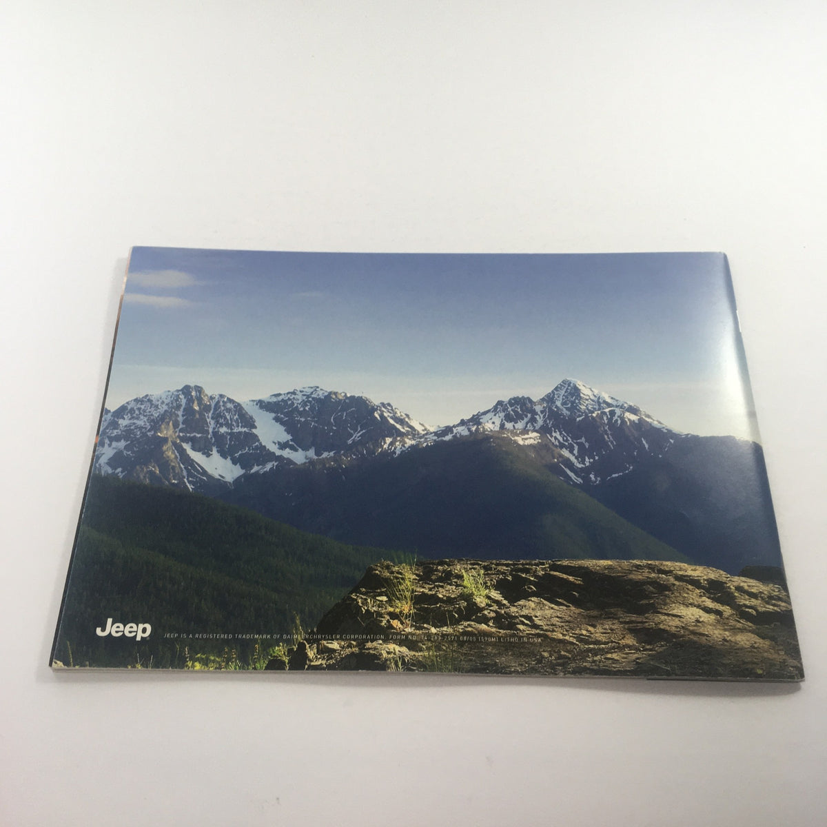 Back cover of the 2006 Jeep Grand Cherokee Dealership Car Auto Brochure Catalog with a scenic mountain view.