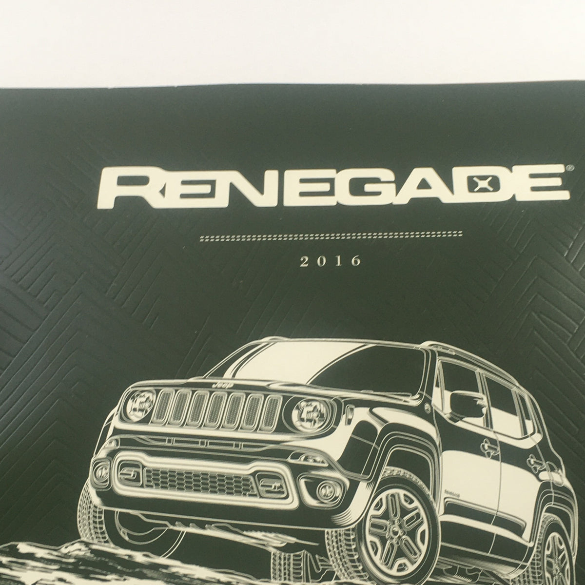 Close-up of the title and illustration on the cover of the 2016 Jeep Renegade Dealership Car Auto Brochure Catalog.