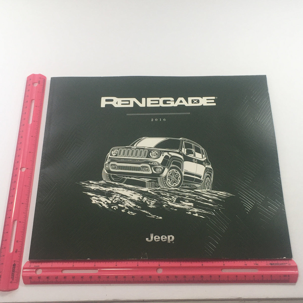 Front cover of the 2016 Jeep Renegade Dealership Car Auto Brochure Catalog, featuring a detailed illustration of the Jeep Renegade and showcasing its unique design.