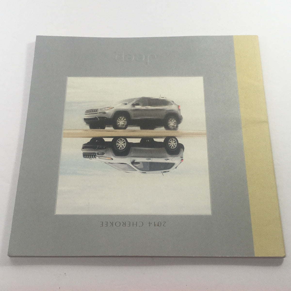 Cover of the 2014 Jeep Cherokee SUV Dealership Car Auto Brochure Catalog featuring the iconic Jeep logo and a stylized image of the vehicle.