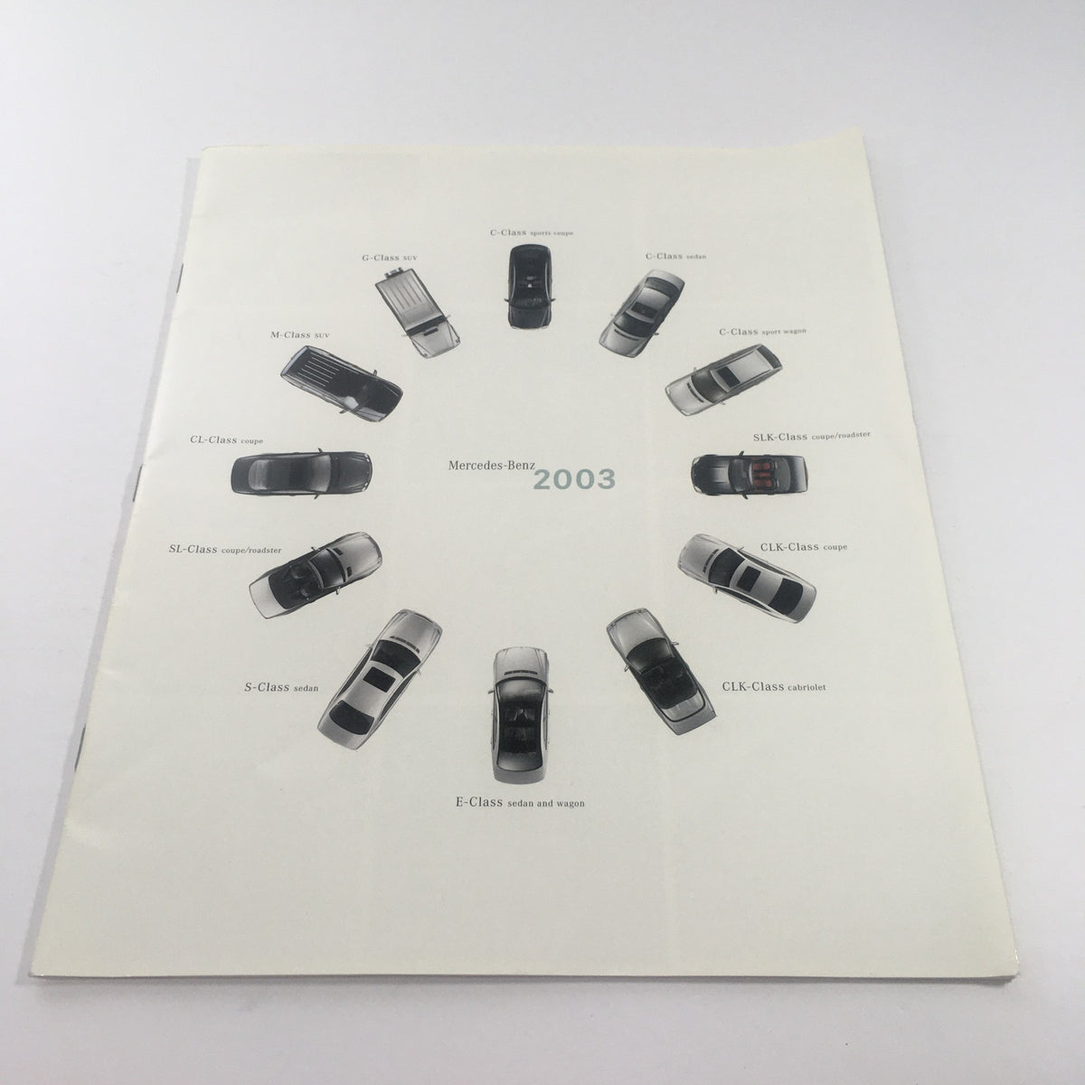 Cover page of the 2003 Mercedes-Benz C-Class, SLK-Class Dealership Car Auto Brochure Catalog featuring various Mercedes-Benz models arranged in a circle.