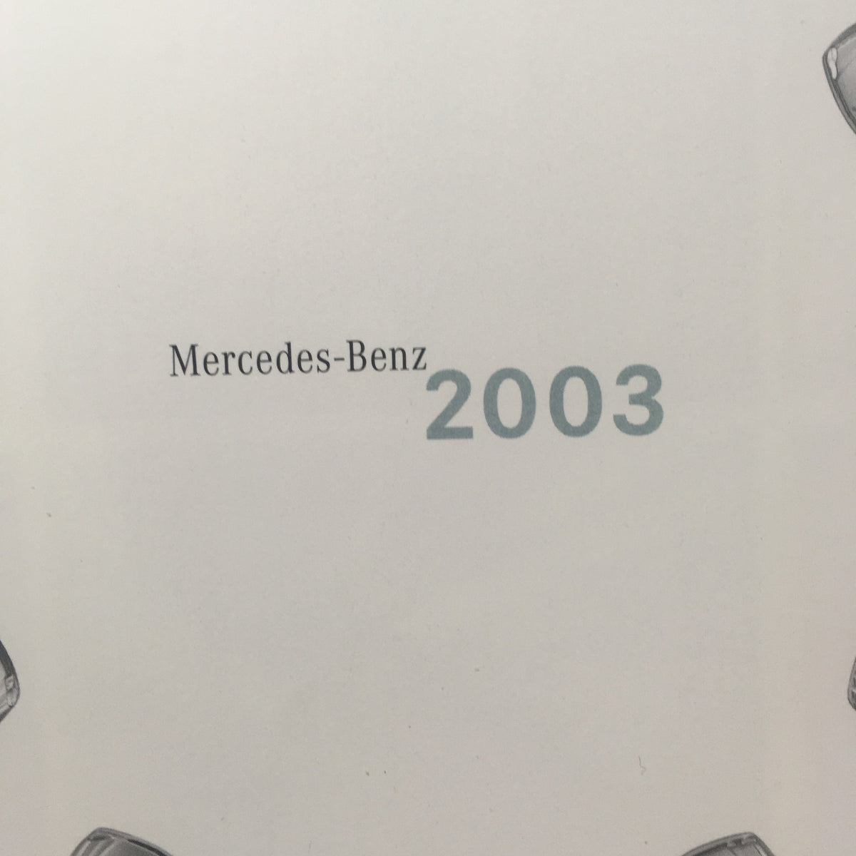 Front detail of the 2003 Mercedes-Benz C-Class, SLK-Class Dealership Car Auto Brochure Catalog showcasing the text 'Mercedes-Benz 2003'.