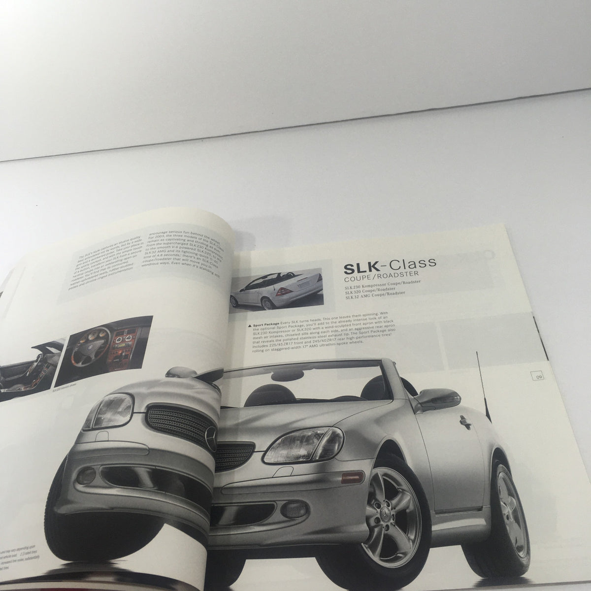 Open page of the 2003 Mercedes-Benz C-Class, SLK-Class Dealership Car Auto Brochure Catalog featuring the SLK-Class coupe/roadster with focus on its design.