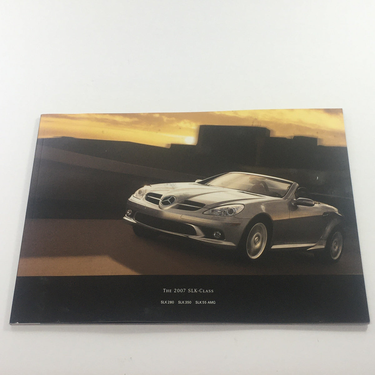 2007 Mercedes-Benz SLK-Class SLK 280-350-55 Dealership Car Auto Brochure Catalog featuring the stylish front view of the car against a sunset backdrop.