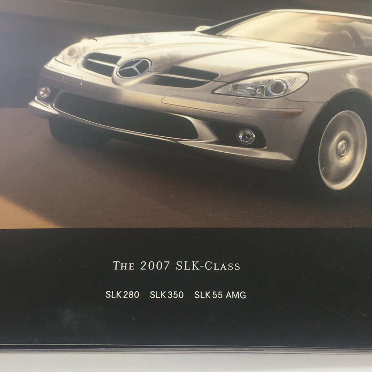 Close-up image of the 2007 Mercedes-Benz SLK-Class SLK 280-350-55 Dealership Car Auto Brochure Catalog showcasing vehicle model details.