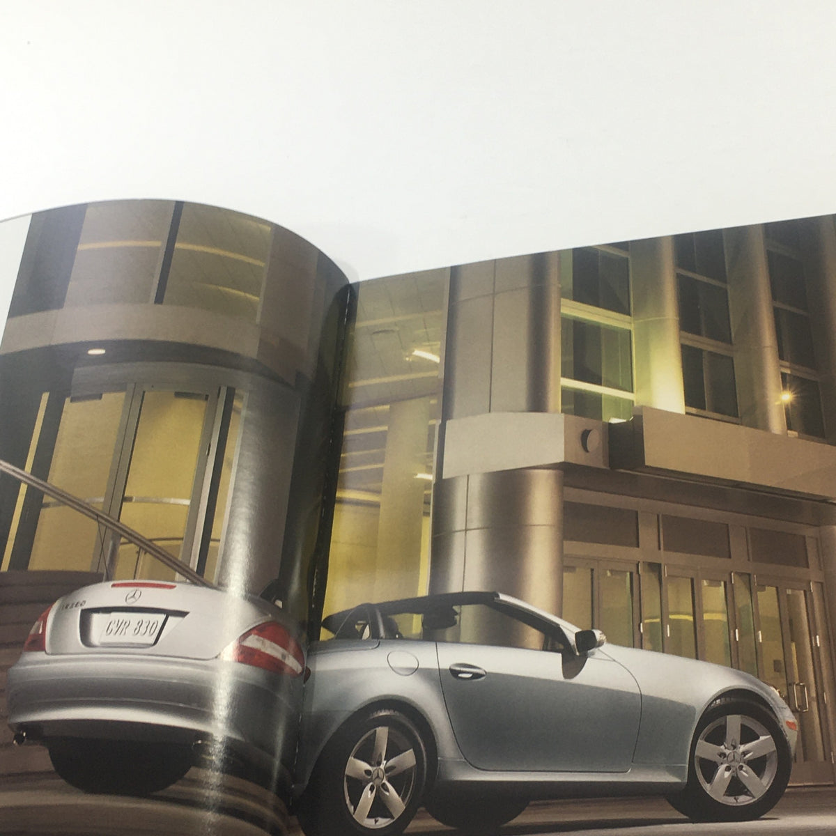 Interior view of the 2007 Mercedes-Benz SLK-Class SLK 280-350-55 Dealership Car Auto Brochure Catalog displaying the car parked in an urban setting.