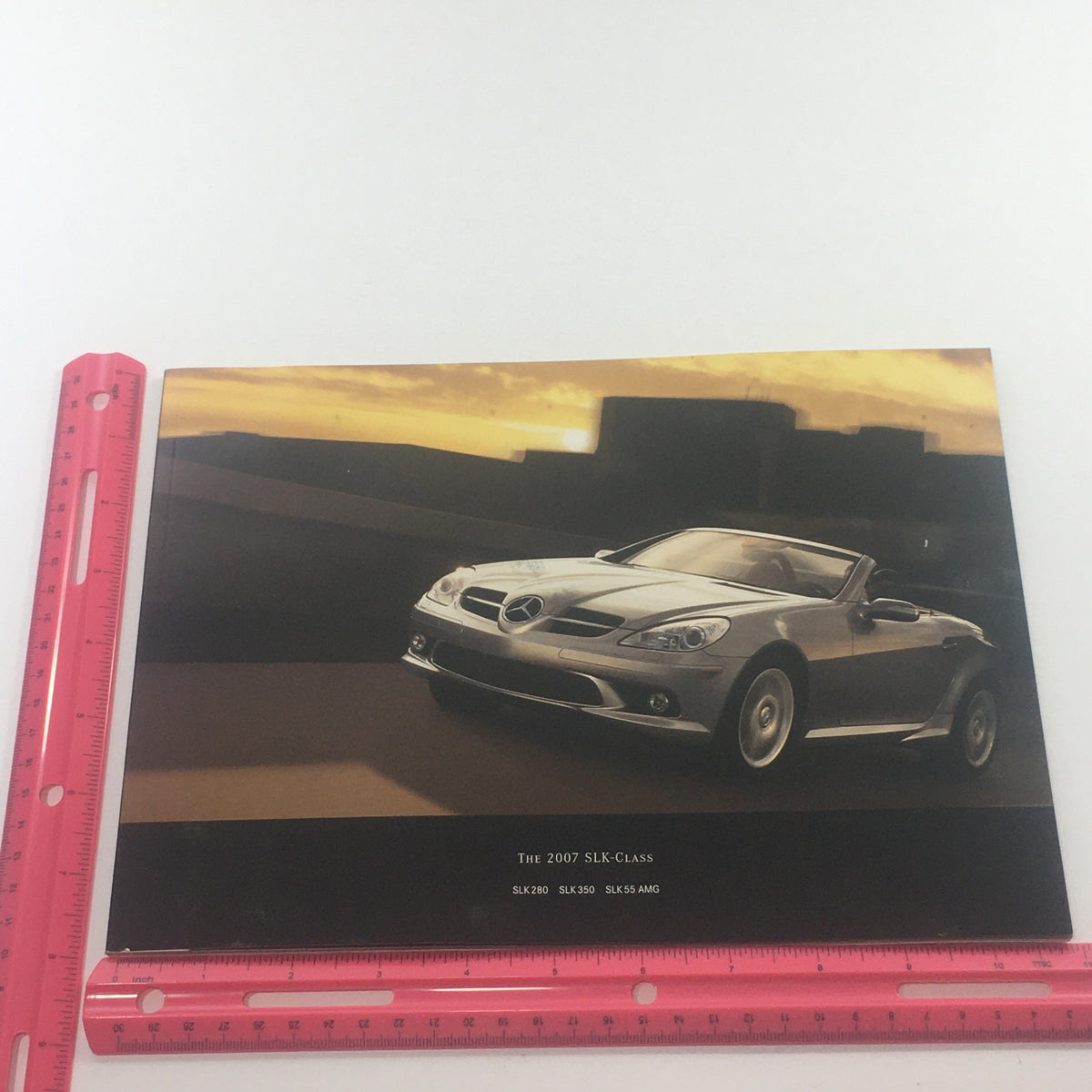 Front cover of the 2007 Mercedes-Benz SLK-Class SLK 280-350-55 Dealership Car Auto Brochure Catalog with a stylish image of a silver convertible against a sunset backdrop.