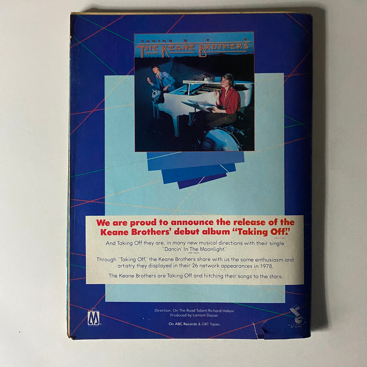 Back cover of 16 Magazine June 1979 featuring a promotional announcement for the Keane Brothers' debut album 'Taking Off', showcasing the album artwork and details about their music.