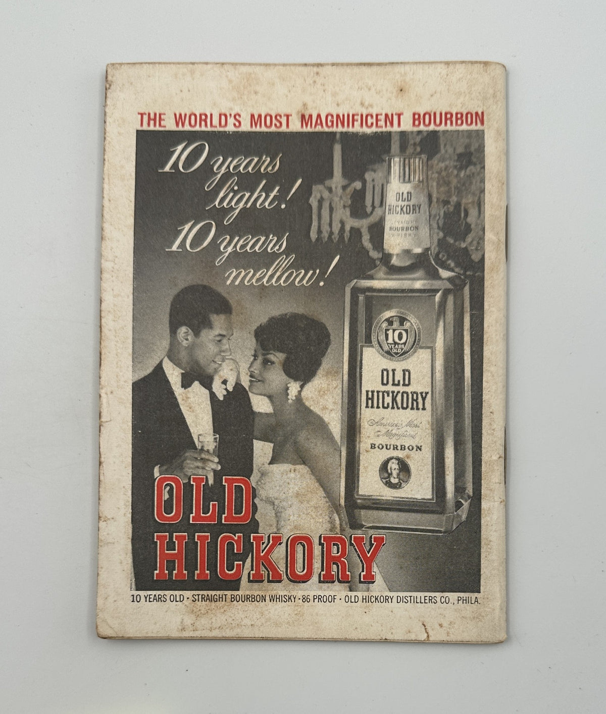 Advertisement for Old Hickory Bourbon from Jet Magazine October 19, 1961, showcasing a couple at an elegant event with the whiskey bottle prominently displayed.