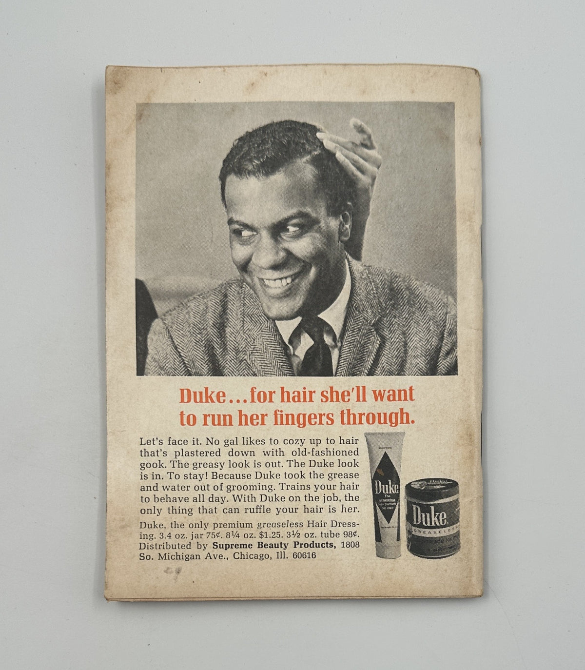 Advertisement in Jet Magazine from May 9, 1968 for Duke Hair Dressing. The ad features a smiling man highlighting the benefits of using Duke products for maintaining stylish hair.