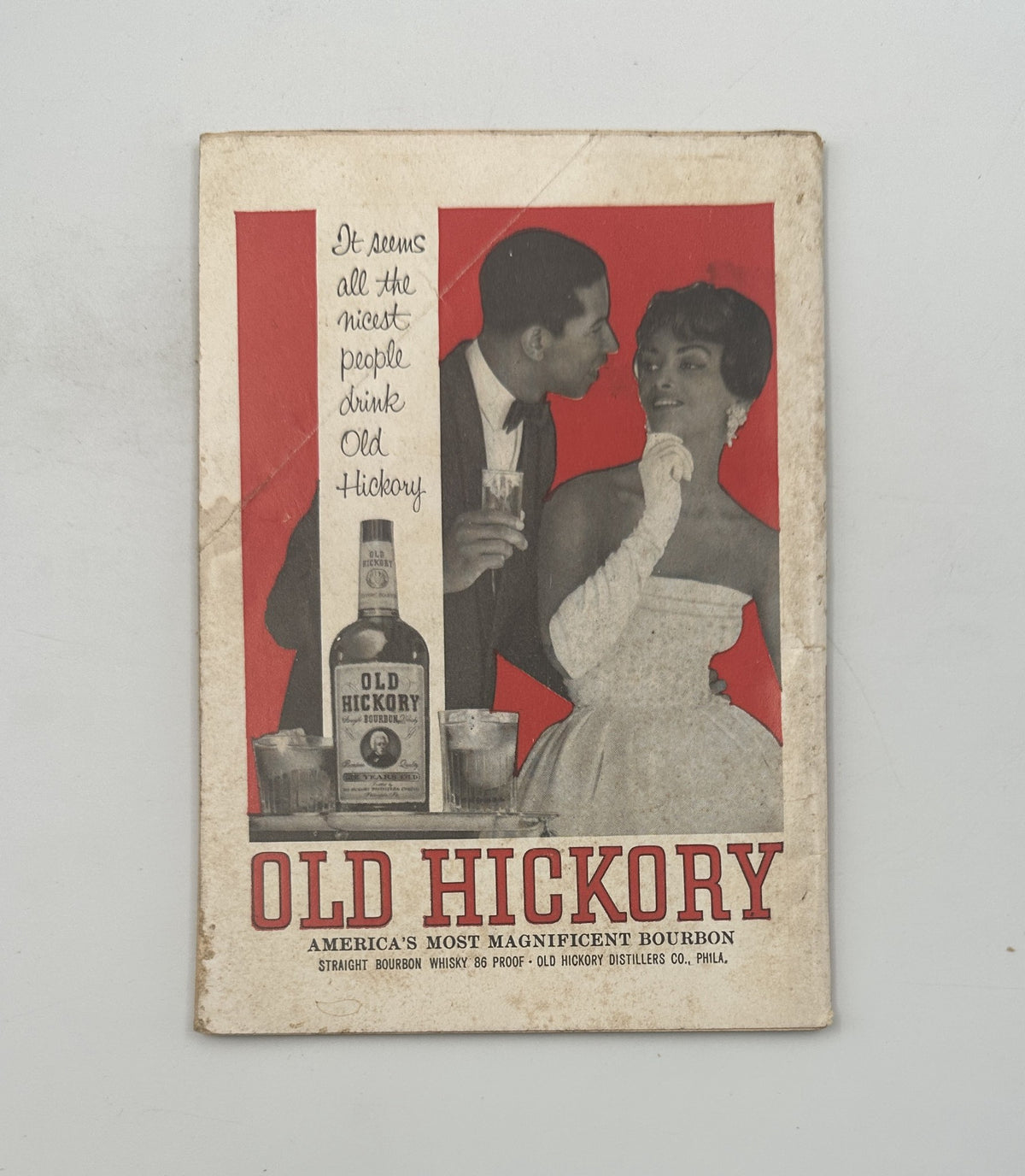 Advertisement page in Jet Magazine, November 15, 1962, showcasing Old Hickory Bourbon with a visual of a couple enjoying drinks, reflecting mid-century marketing aesthetics.