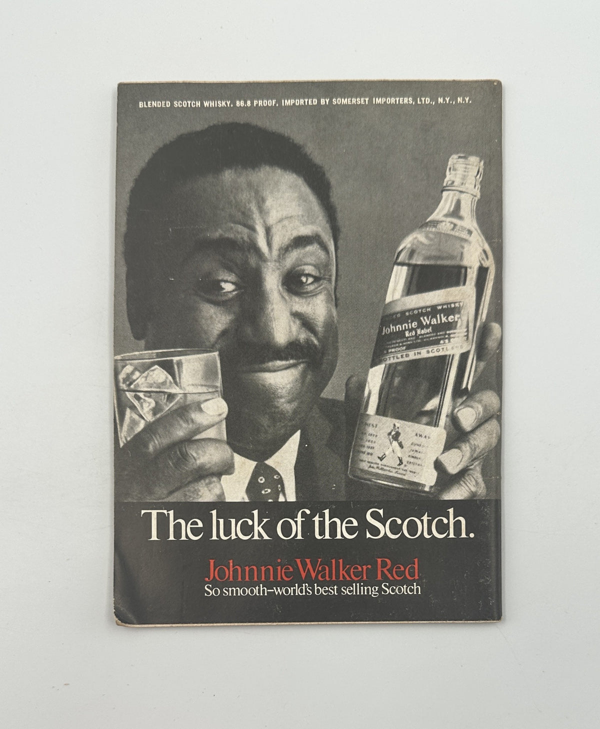 Advertisement in Jet Magazine March 13, 1969 for Johnnie Walker Red Scotch, showcasing a man holding a drink and promoting its smooth quality.